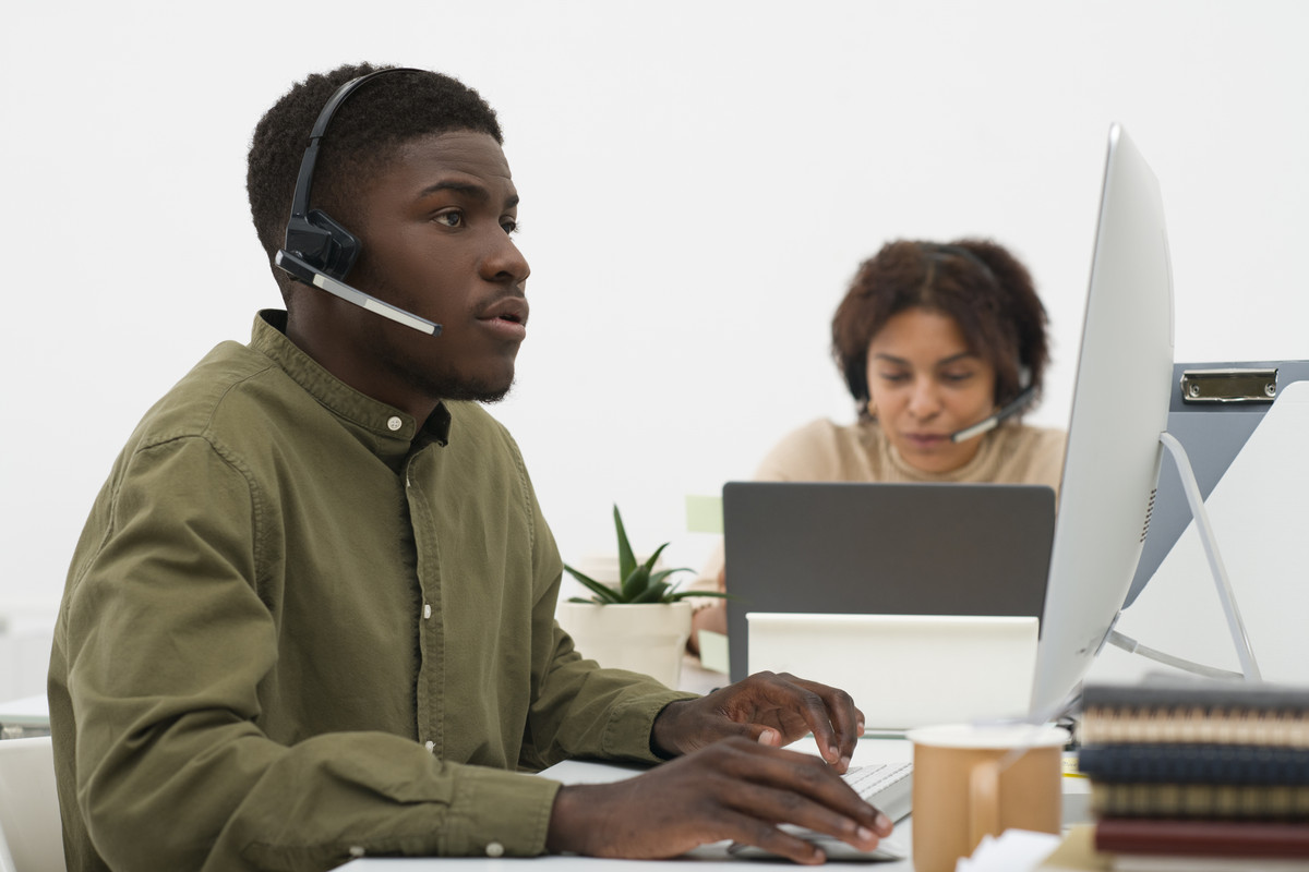 A friendly customer support agent with a headset